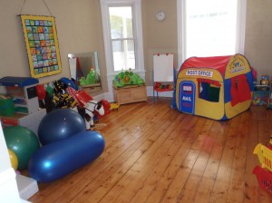 This is the front room where a lot of imaginary play happens. We have dress up clothes, a play tent, legos, building blocks and so much more!